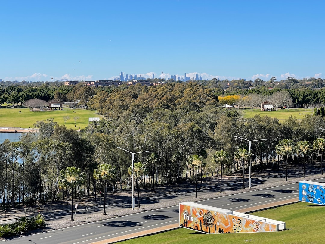 Bicentennial Park and Sydney Olympic Park parkland with Sydney skyline in the distance